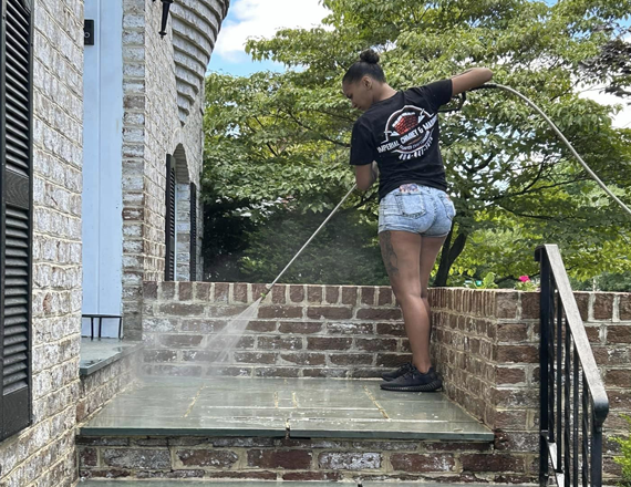 Cleaned masonry surface