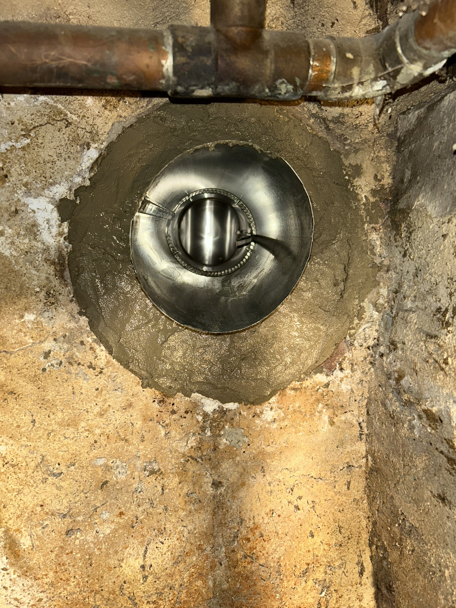Wall thimble and tee snout installed for liner connection